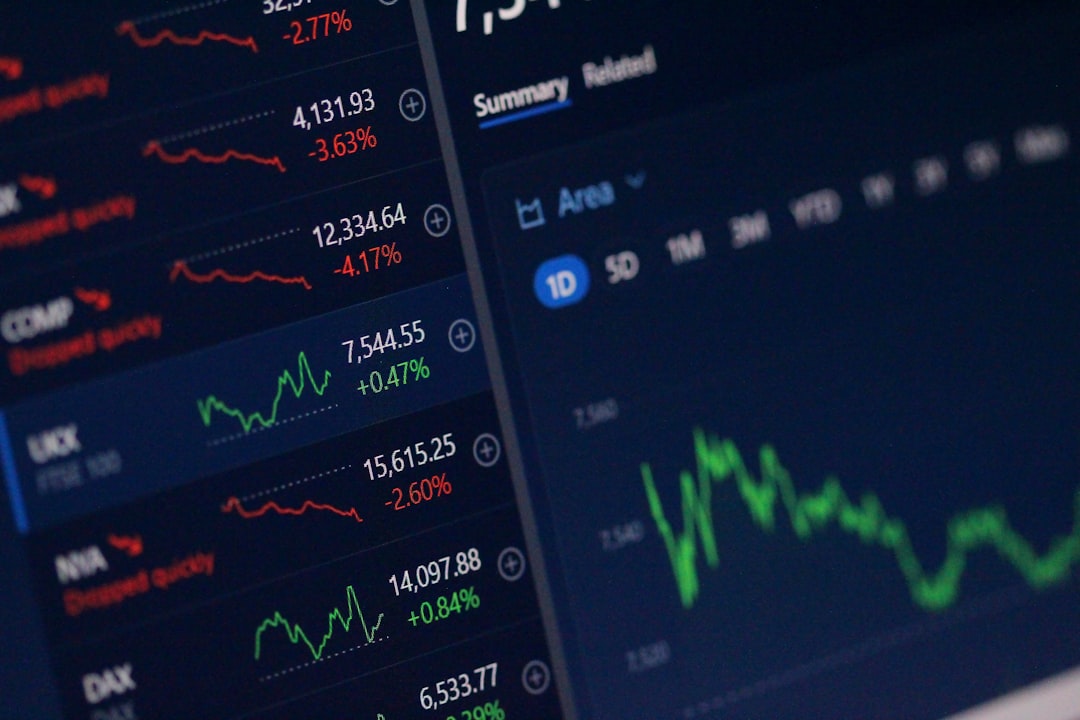 Financial market data displayed on computer screens