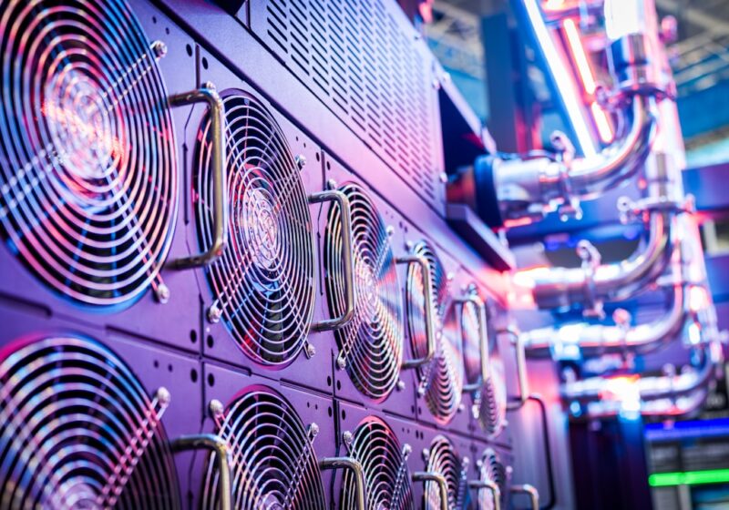 Close-up of server cooling fans in a data center, representing autonomous AI systems and cybersecurity risk.