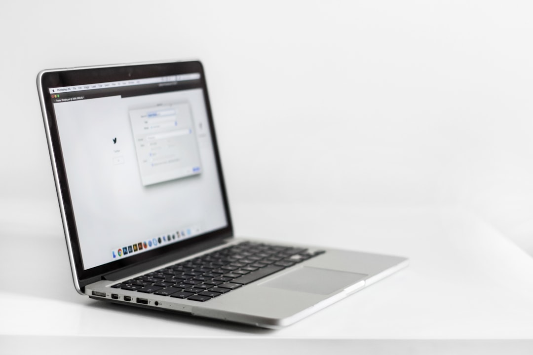 Laptop open to a web browser at a workspace, illustrating AI-assisted and agentic browsing.