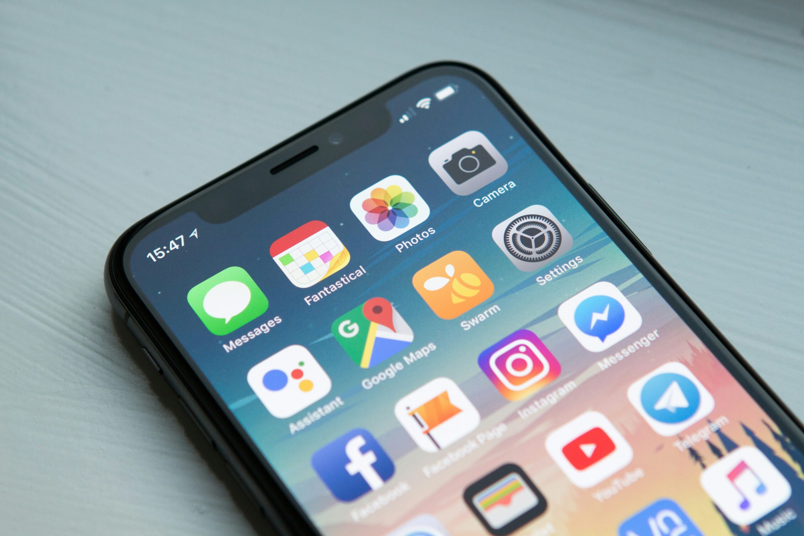 Smartphone displaying a grid of mobile apps