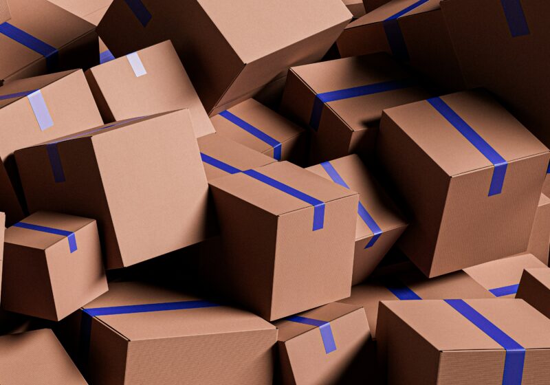 Large stack of cardboard shipping boxes in a warehouse