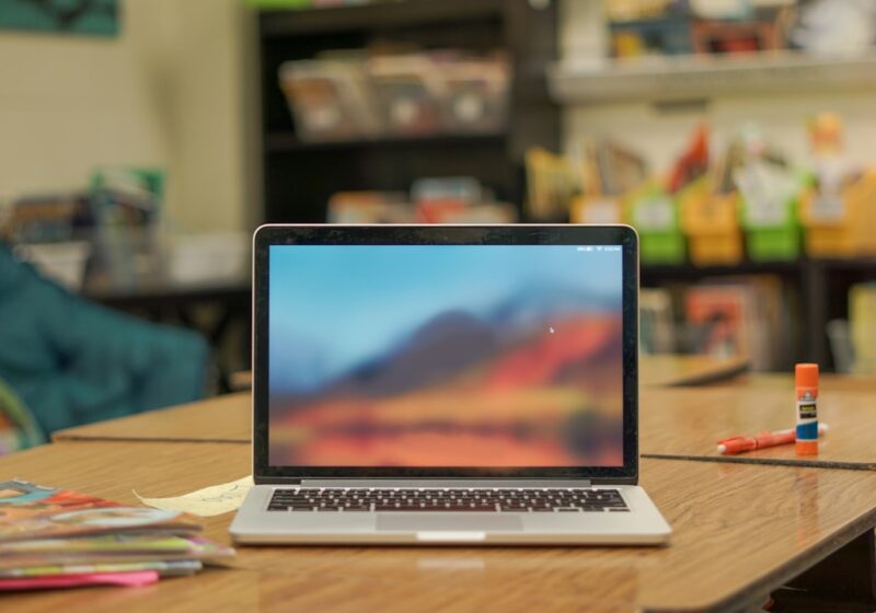 Laptop on a desk in a classroom