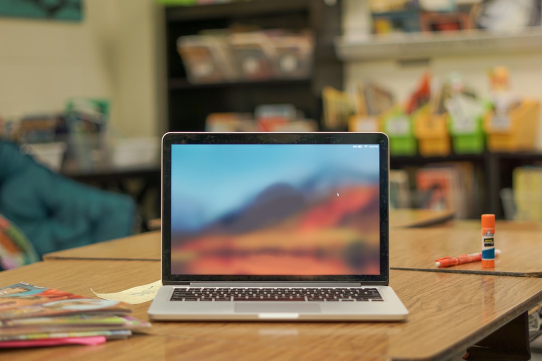 Laptop on a desk in a classroom