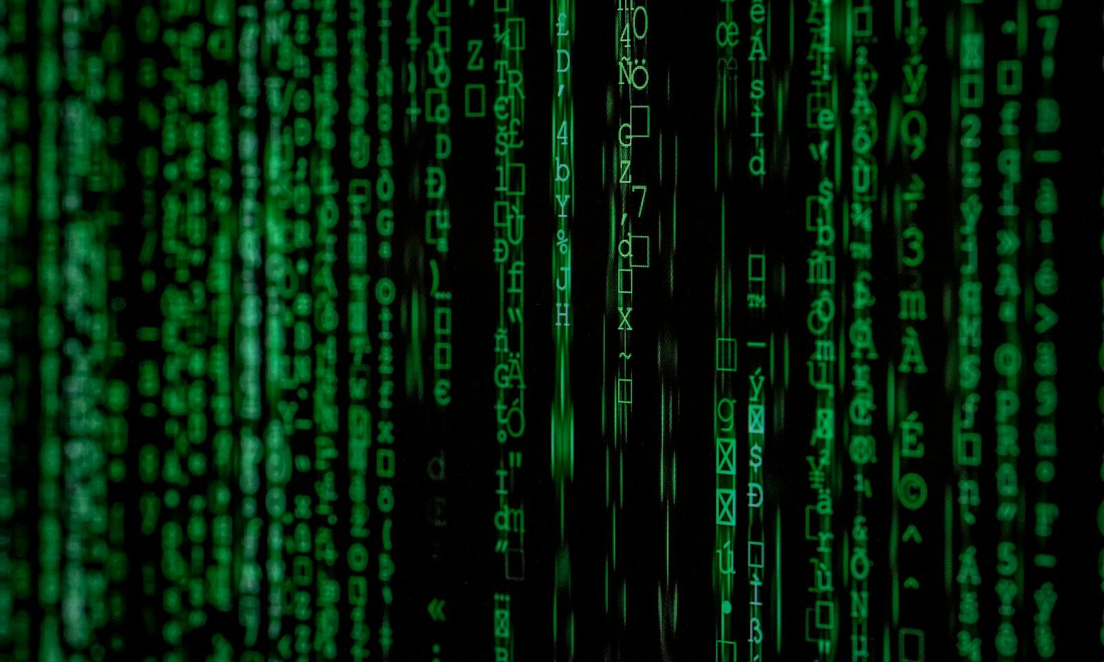 Computer code on a dark screen, illustrating cyber defense
