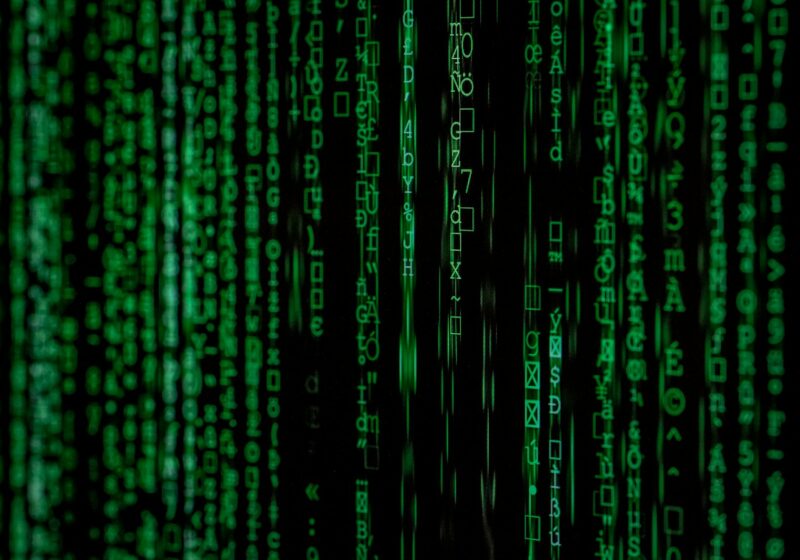 Computer code on a dark screen, illustrating cyber defense