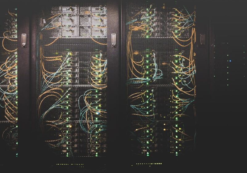 Rows of illuminated server racks inside a data center