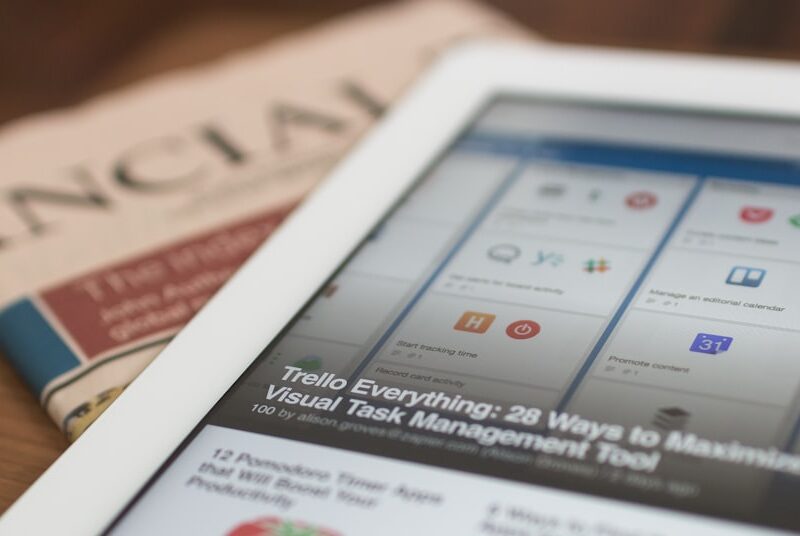 Tablet resting on a newspaper