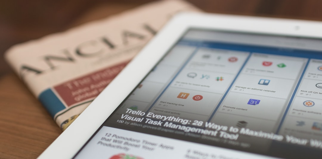 Tablet resting on a newspaper