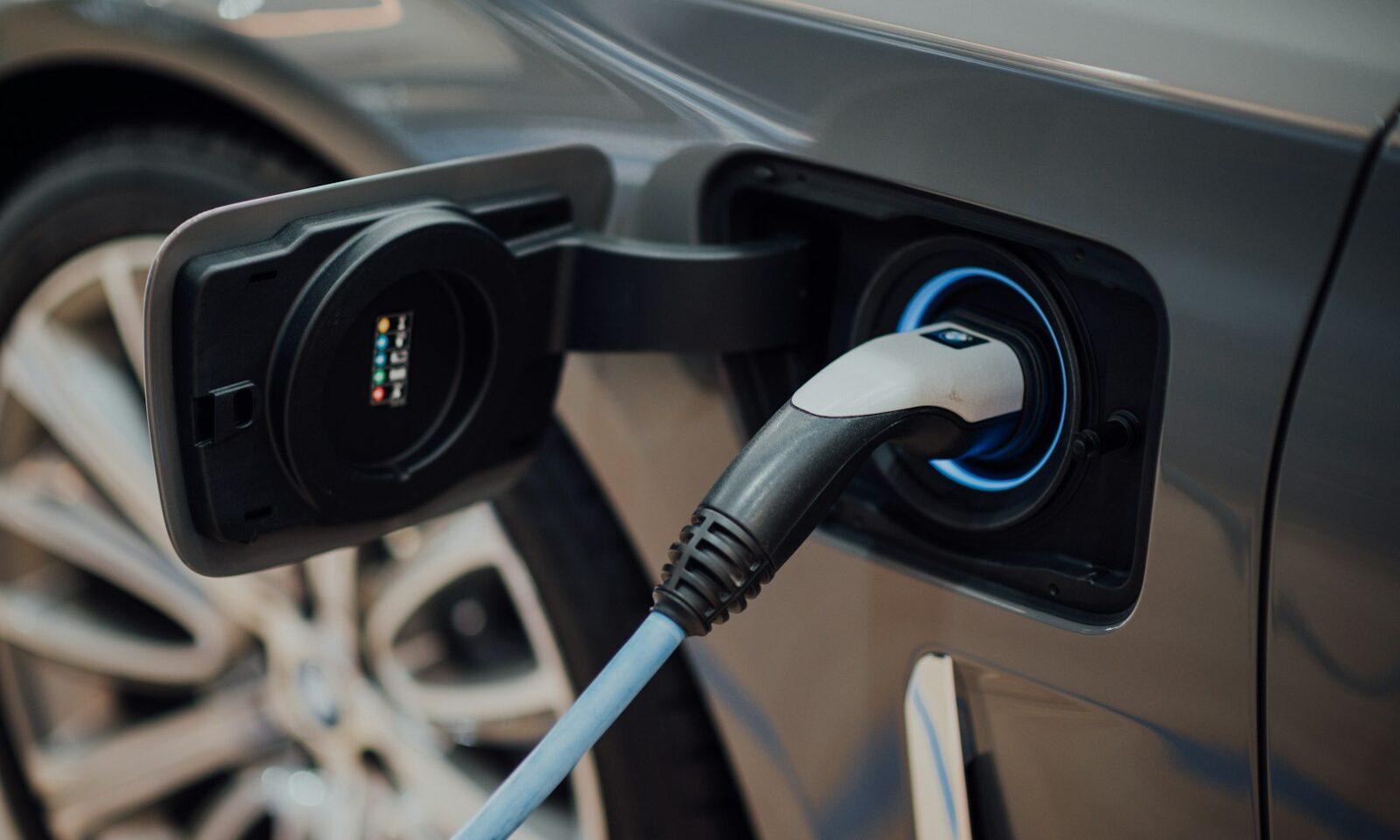 Electric vehicle charging cable connected to a car
