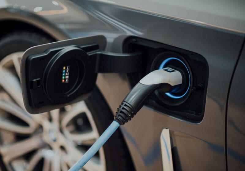 Electric vehicle charging cable connected to a car