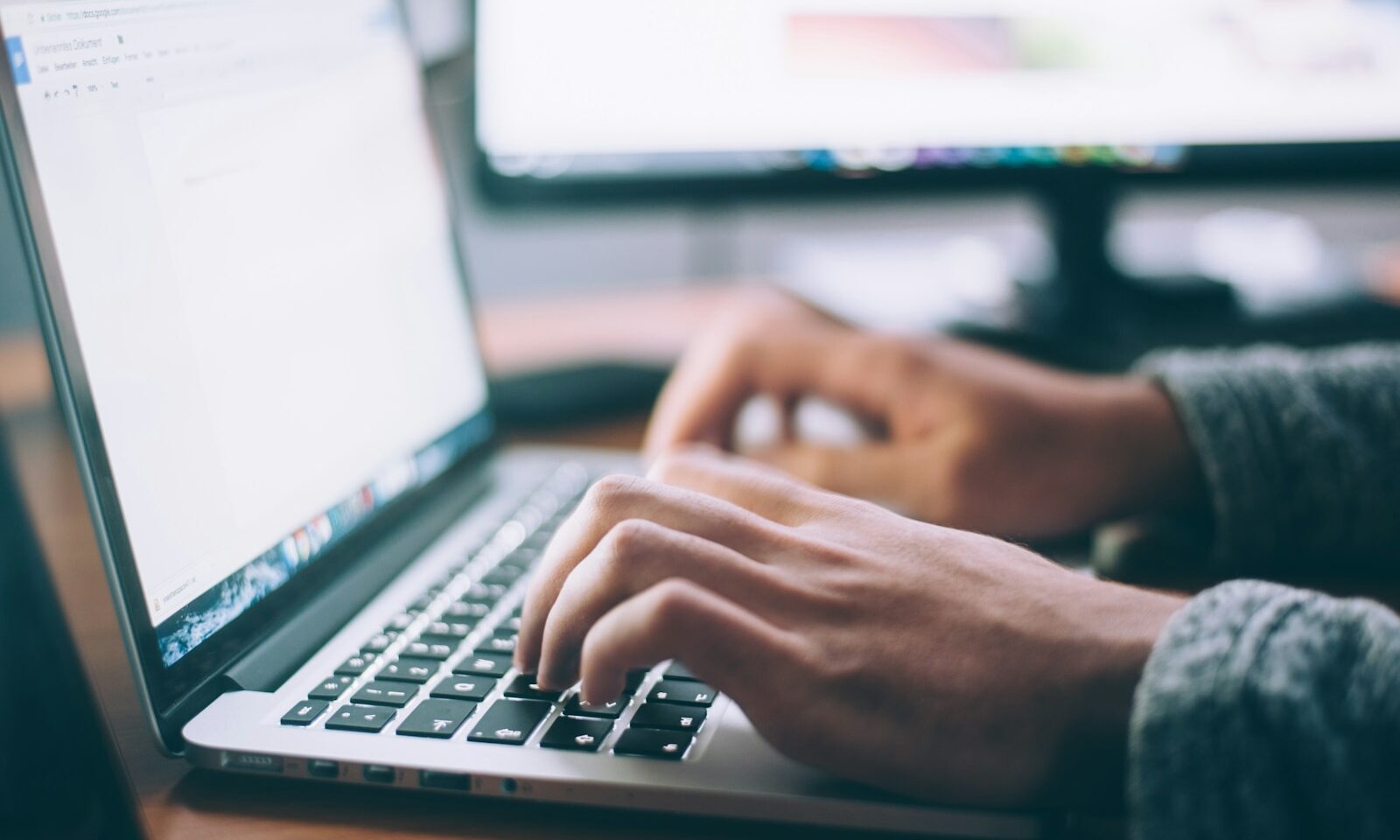 Person using a laptop, illustrating email privacy controls