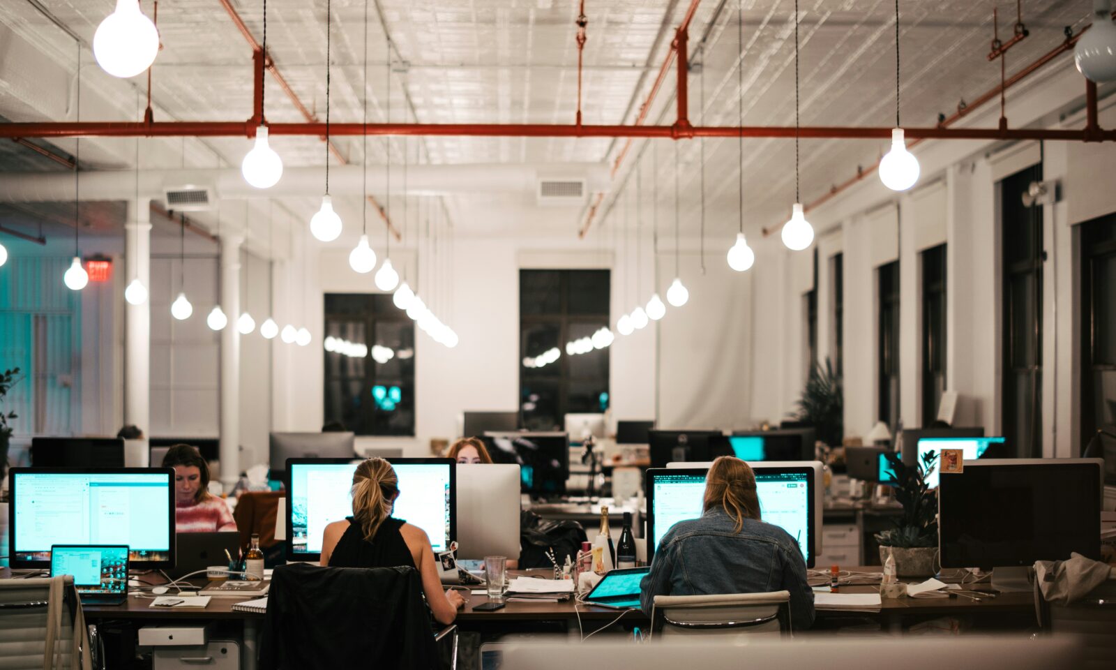 Illustrative photo of a technology consulting team working at computers in an office