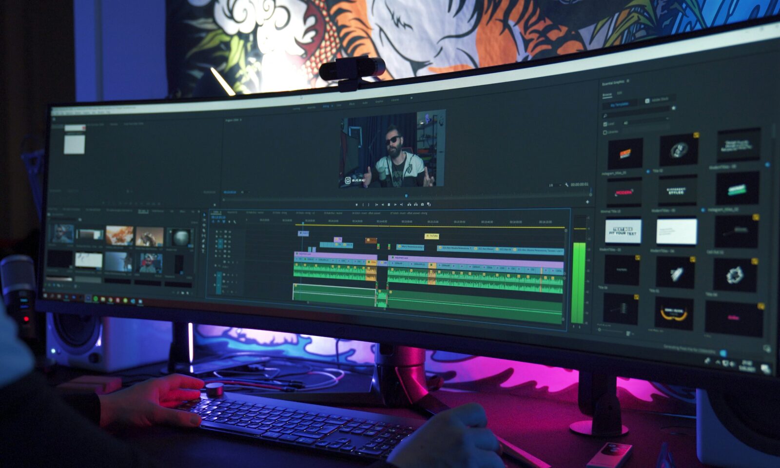 A video editor works at a multimonitor workstation, illustrating AI media production workflows.