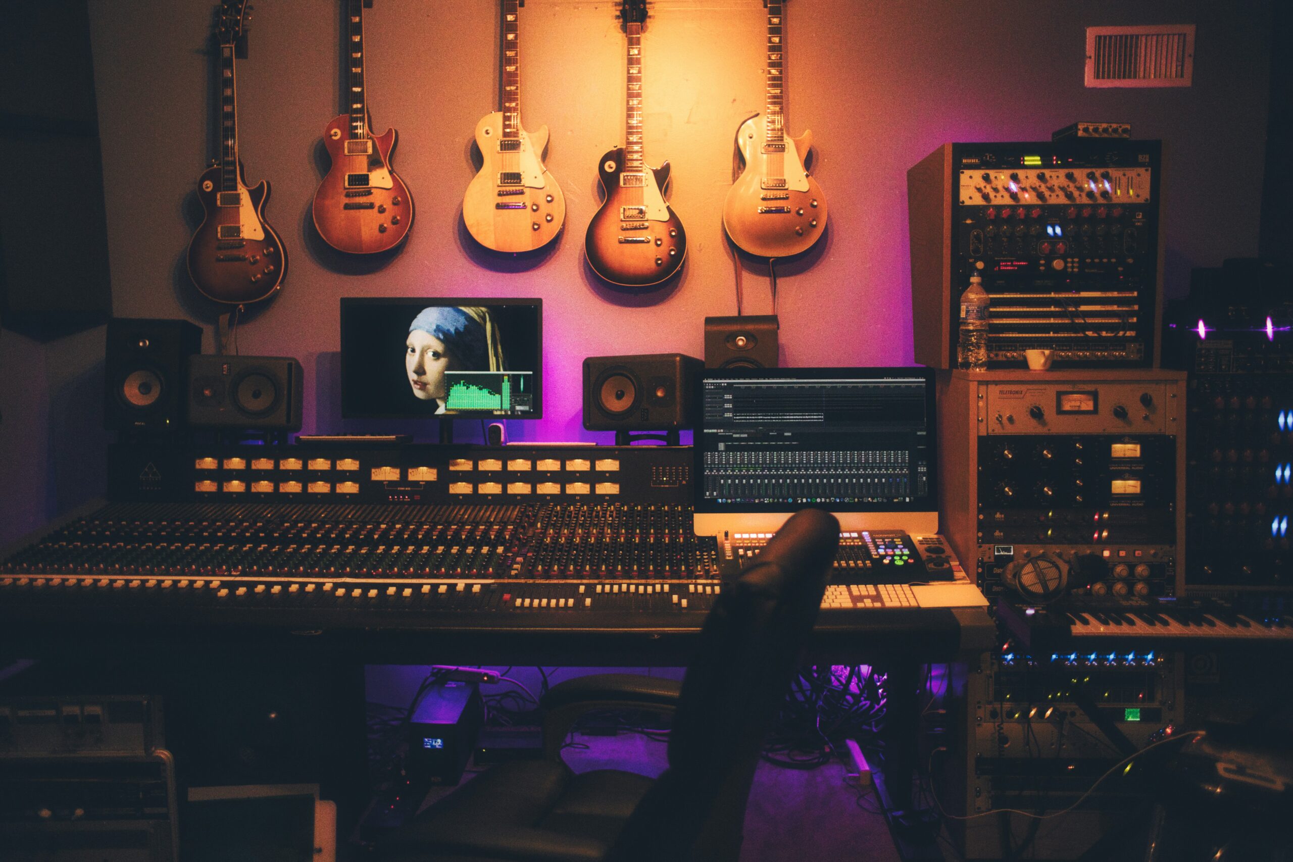 A recording studio with analog equipment, illustrating independent music production.