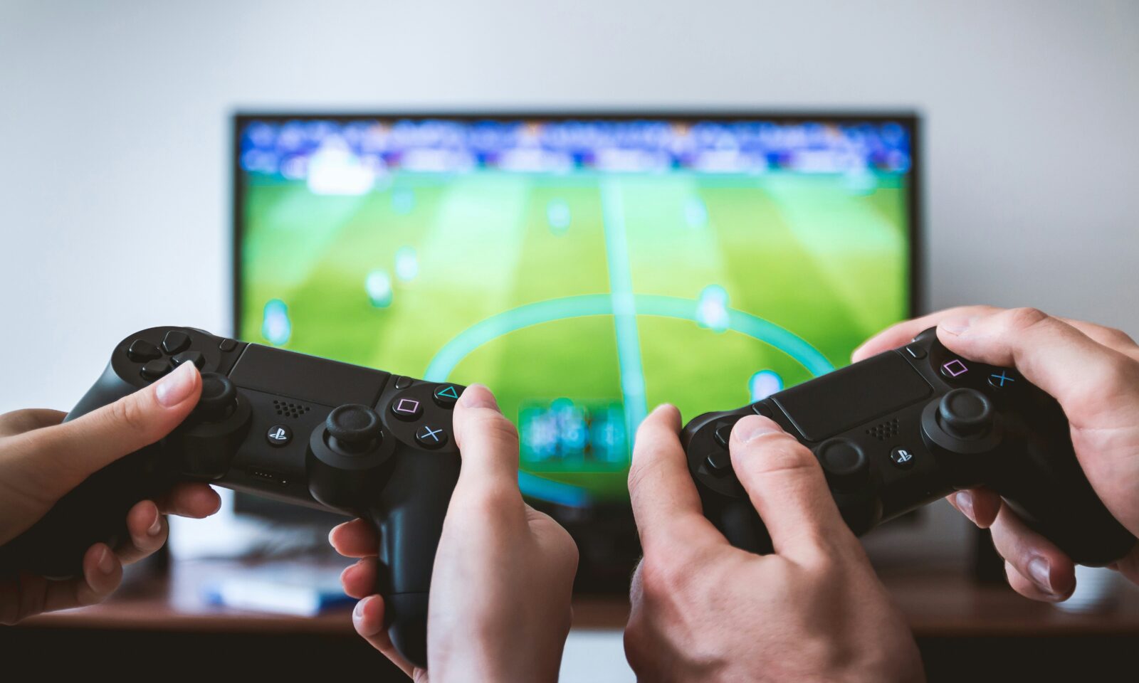 Hands holding game controllers, illustrating cloud games delivered through Prime Video.