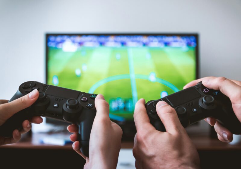 Hands holding game controllers, illustrating cloud games delivered through Prime Video.