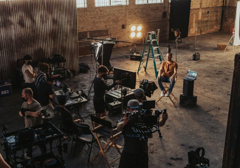 Production crew gathered around a camera, illustrating short-form filmmaking