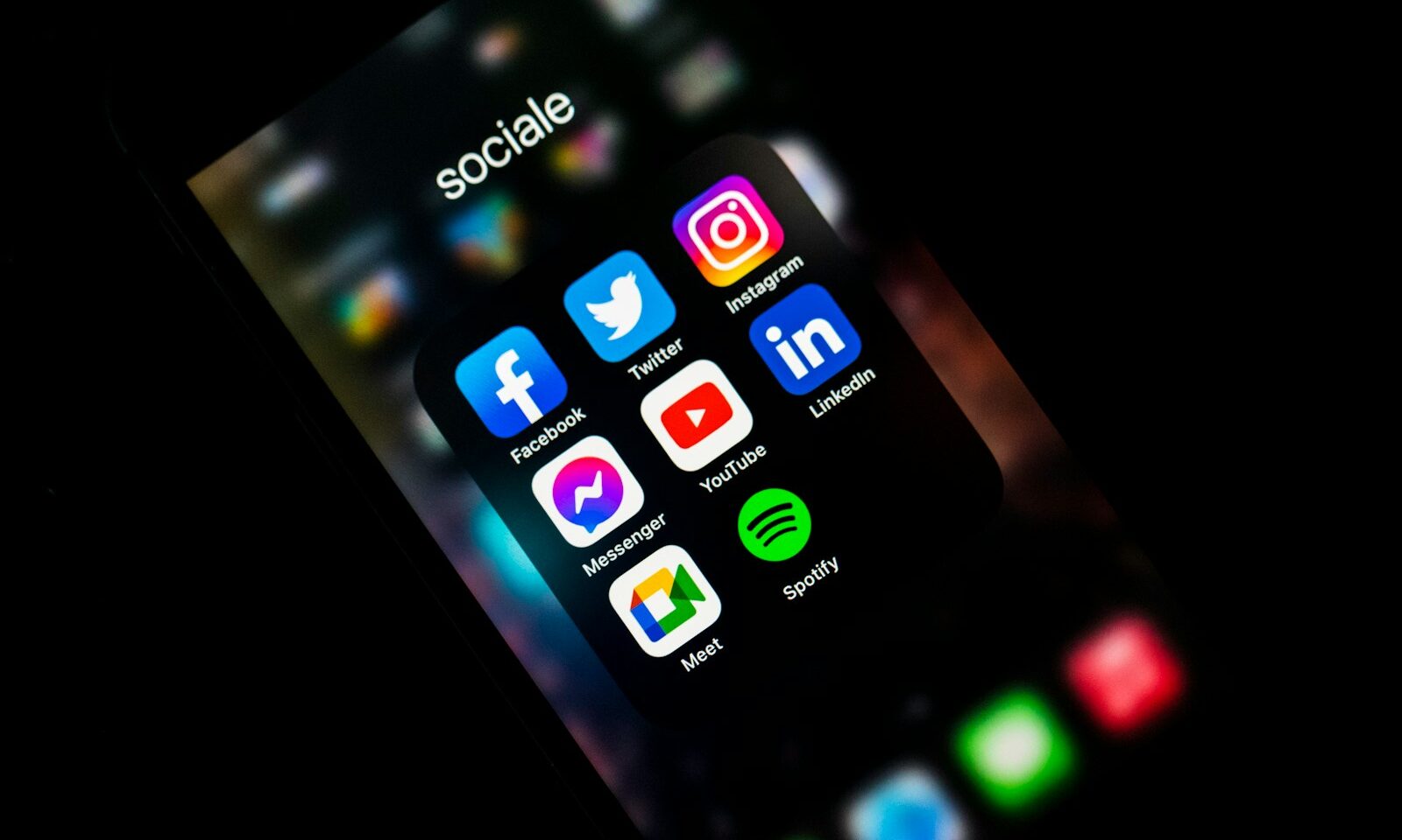 Smartphone displaying social app icons, illustrating the open social web
