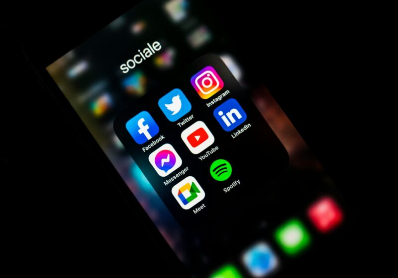 Smartphone displaying social app icons, illustrating the open social web