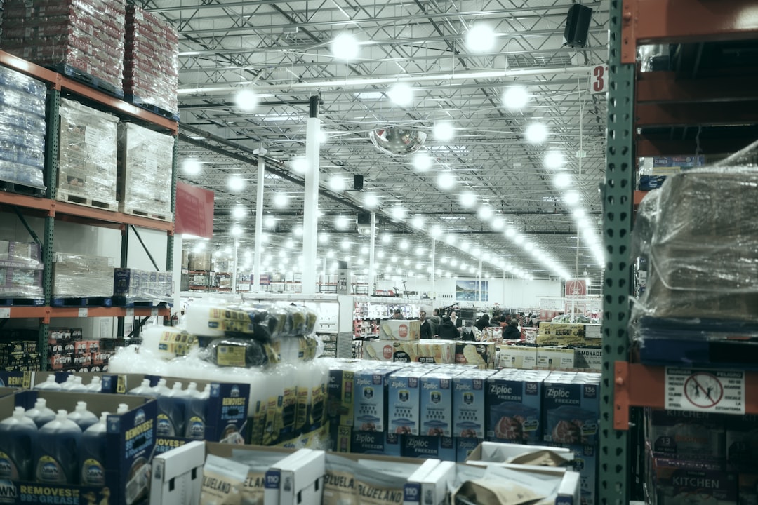 Wide aisle inside a brightly lit warehouse store