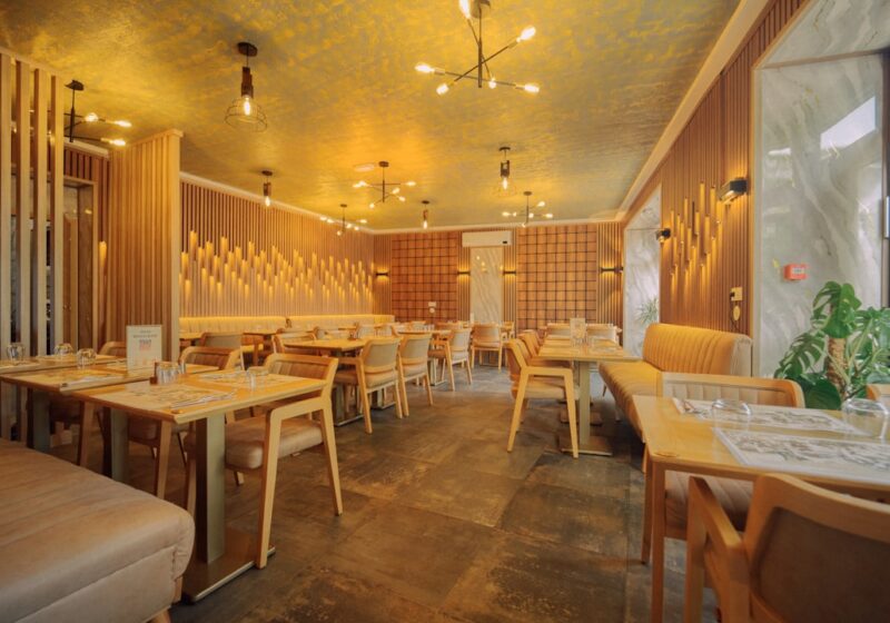 Modern restaurant dining room with tables and warm lighting