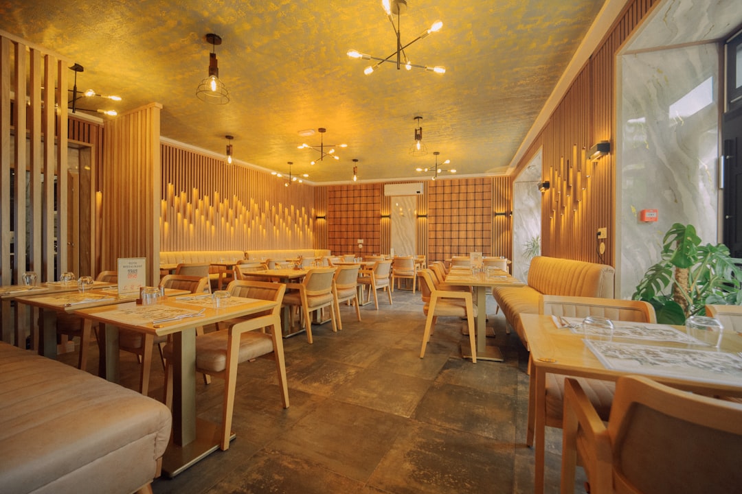 Modern restaurant dining room with tables and warm lighting