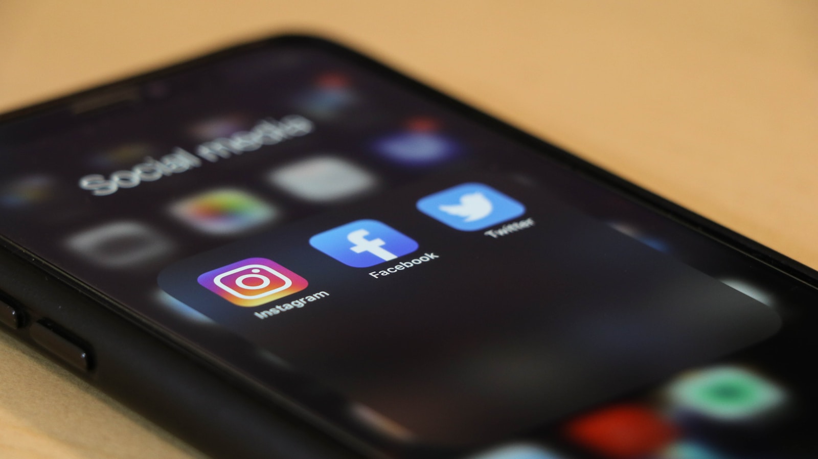 Smartphone on a table, illustrating social media settings