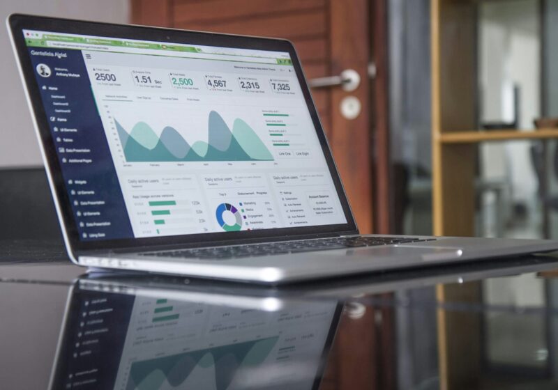 Laptop displaying analytics charts used for digital media planning