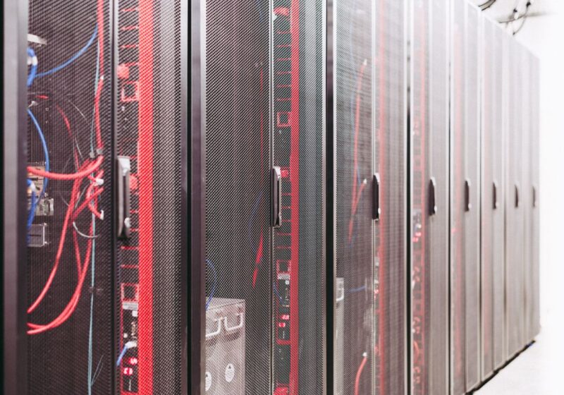Server racks with visible red and blue network cabling.