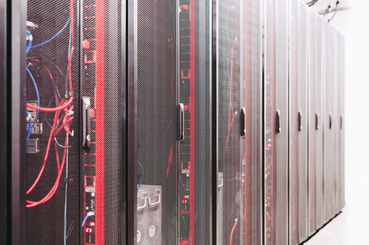 Server racks with visible red and blue network cabling.