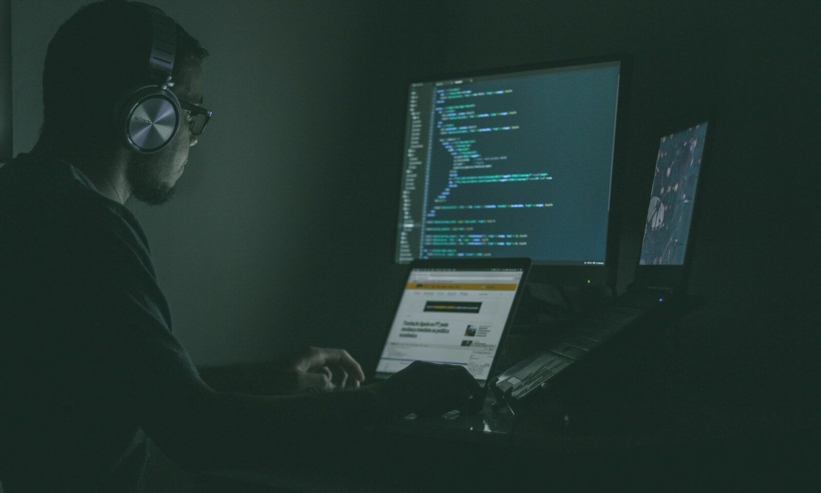 Computer monitors displaying code, illustrating AI model security