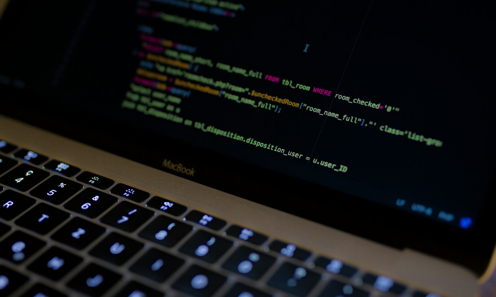 Lines of computer code displayed on a laptop screen