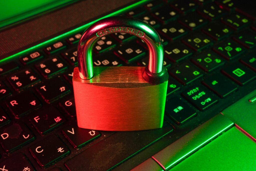Red padlock resting on a computer keyboard