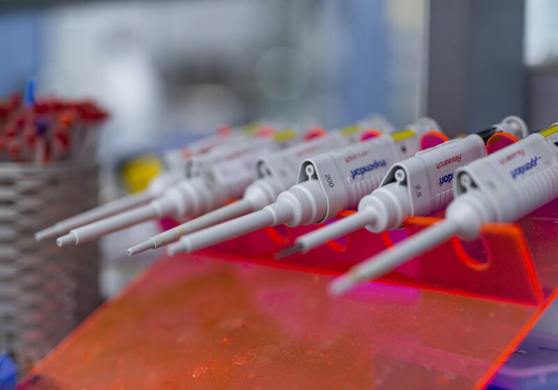 Laboratory pipettes arranged for scientific research, illustrating AI-enabled biology and biosecurity.