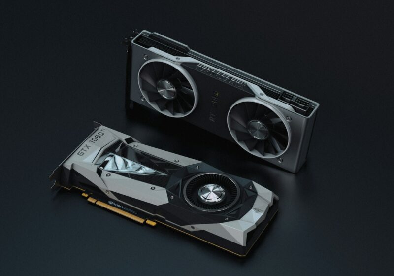 Two Nvidia GeForce graphics cards photographed against a dark background.