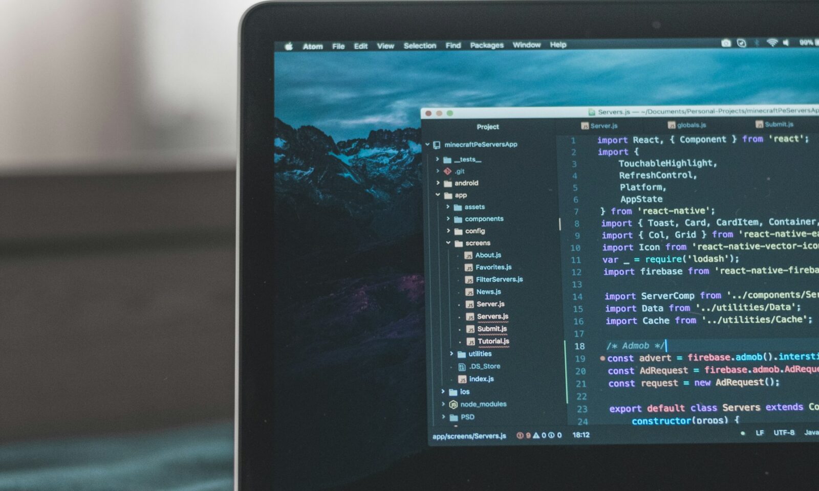 Source code displayed on a laptop screen