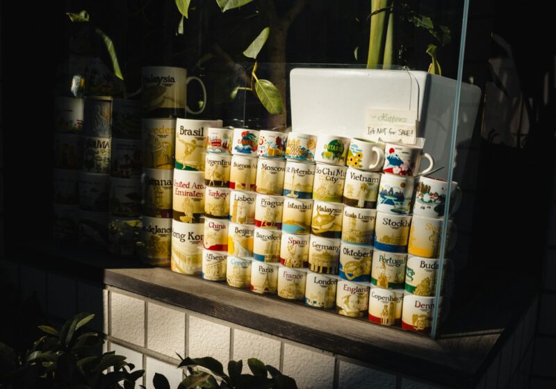 A collection of coffee mugs displayed on retail shelving