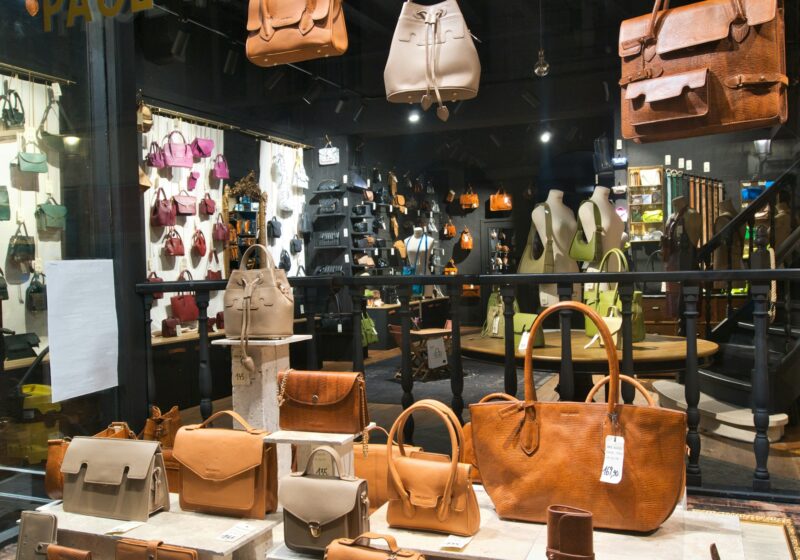 Leather handbags in a retail display illustrating fashion commerce and AI checkout