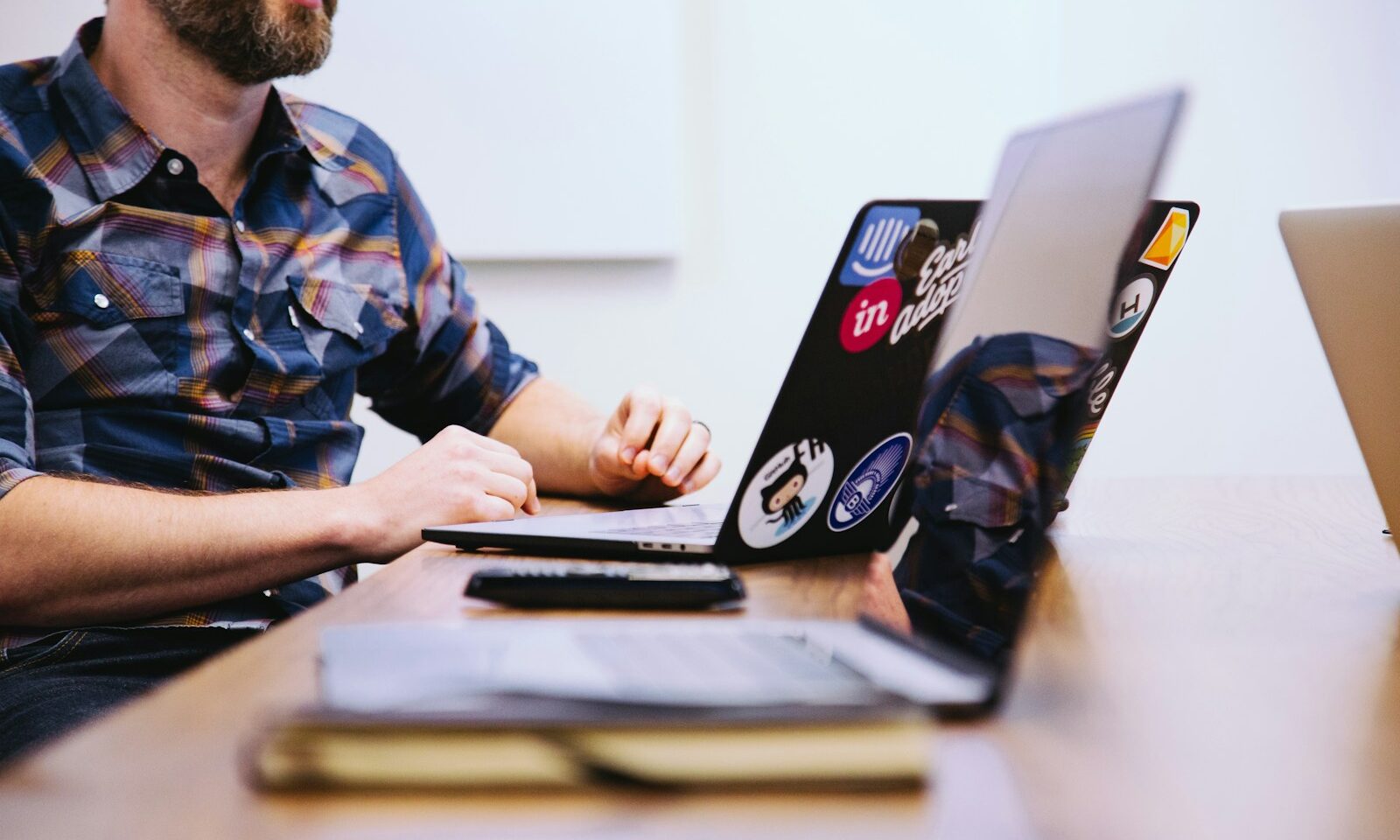 Product design team collaborating around a laptop