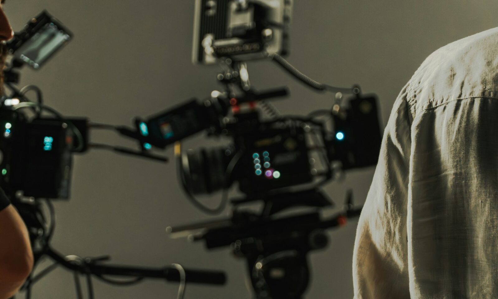 Professional cinema cameras and crew working on a film set