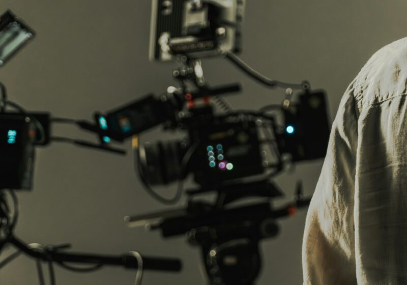 Professional cinema cameras and crew working on a film set