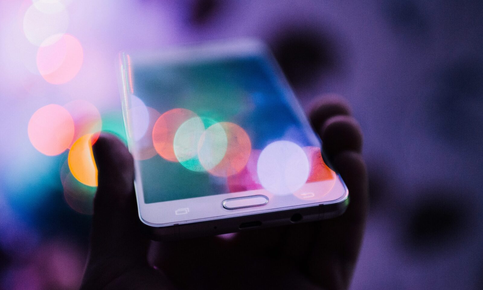 Person holding a smartphone, illustrating mobile financial services