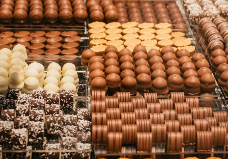 Rows of assorted chocolates arranged in a shop display