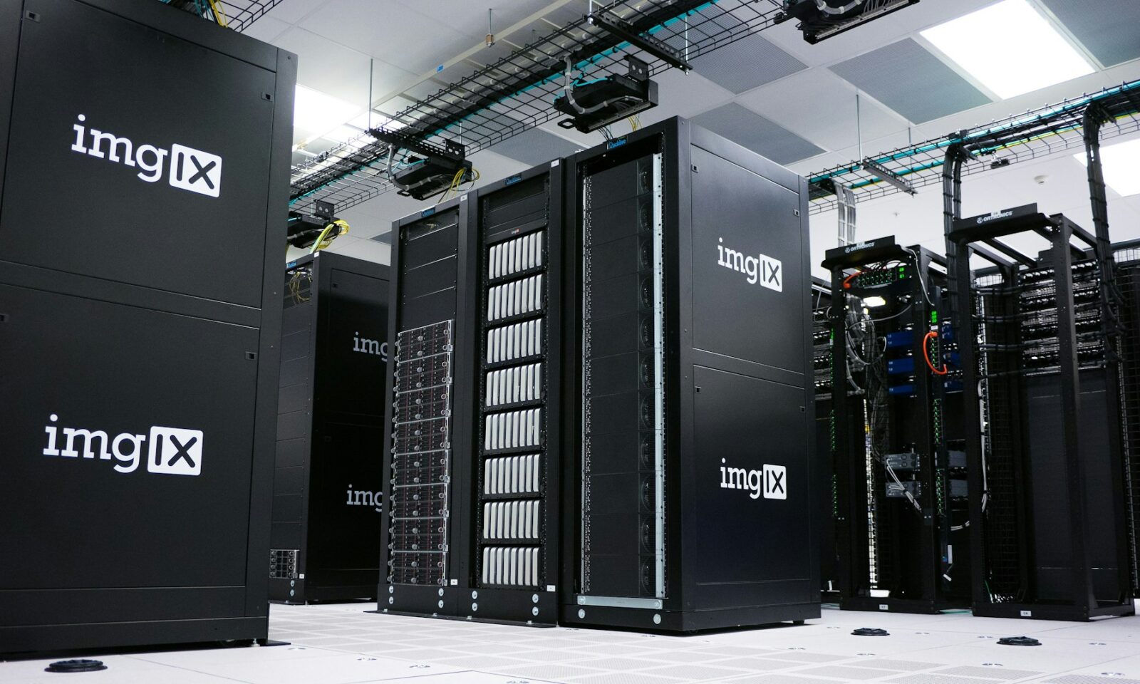Rows of black server racks in a data center, illustrating AI computing infrastructure