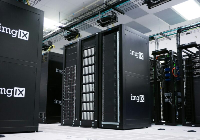 Rows of black server racks in a data center, illustrating AI computing infrastructure