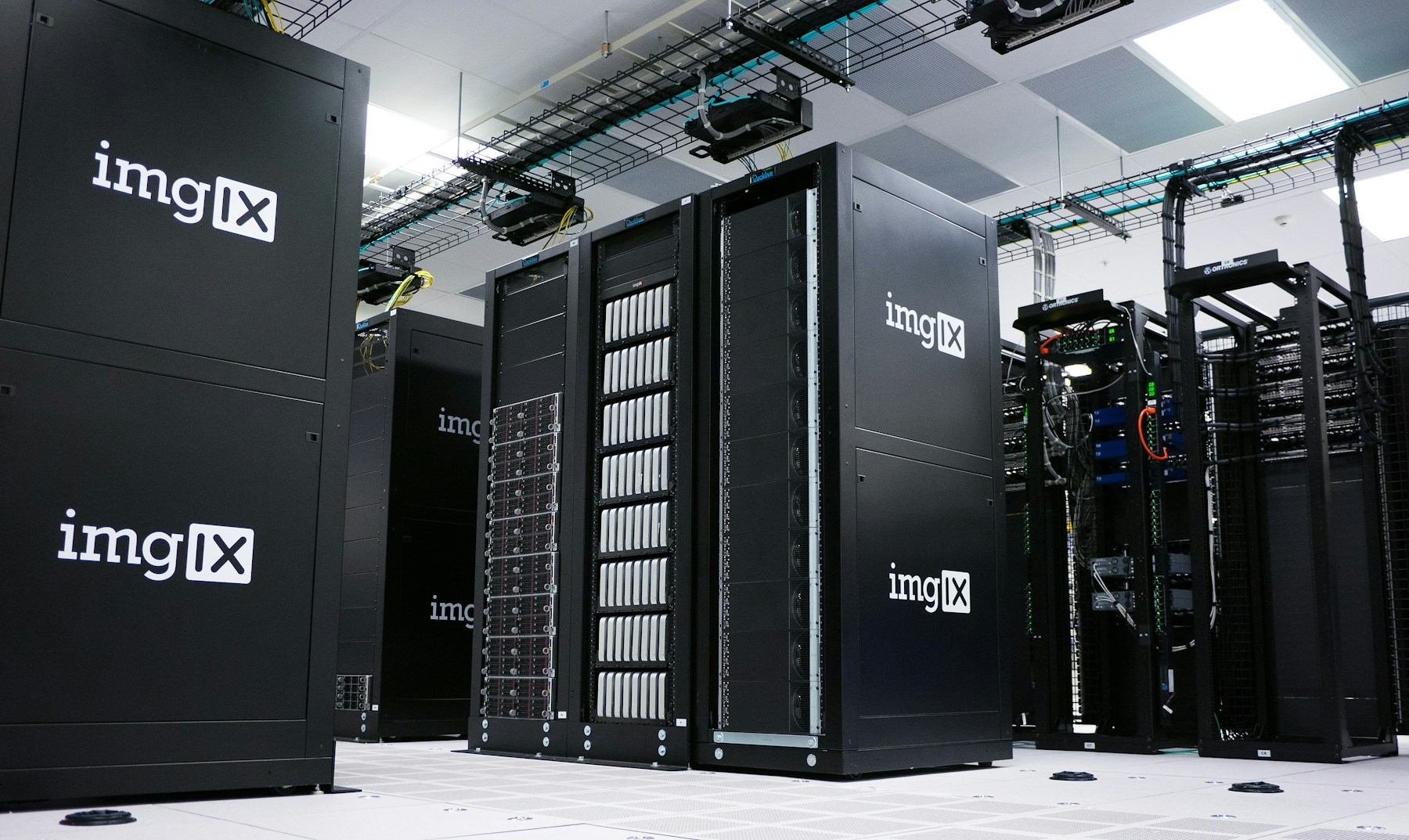 Rows of black server racks in a data center, illustrating AI computing infrastructure