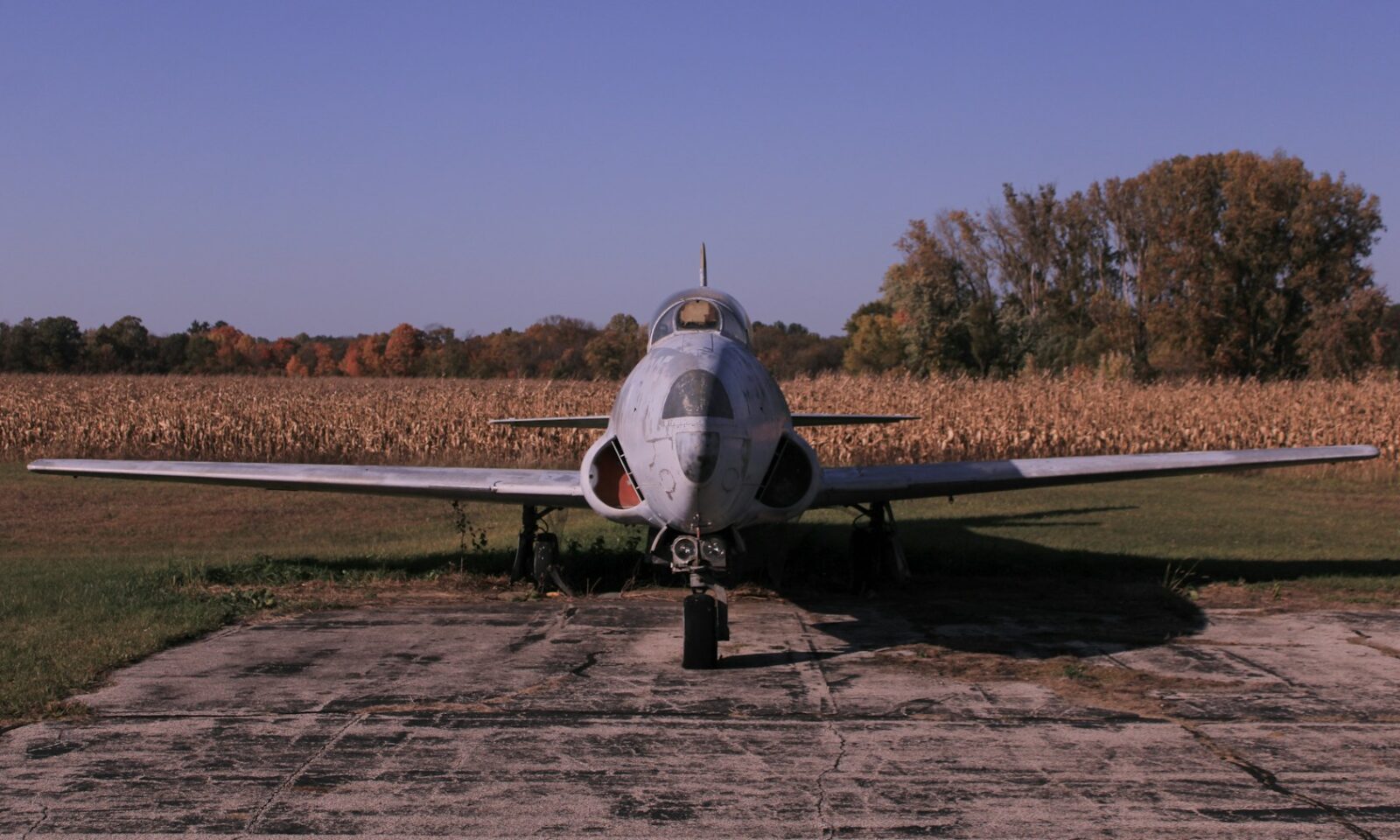 Small aircraft parked on an airport runway