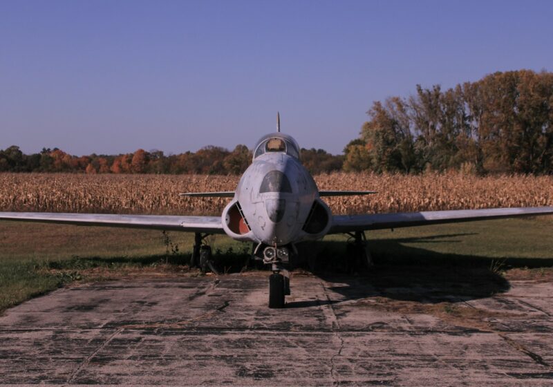 Small aircraft parked on an airport runway