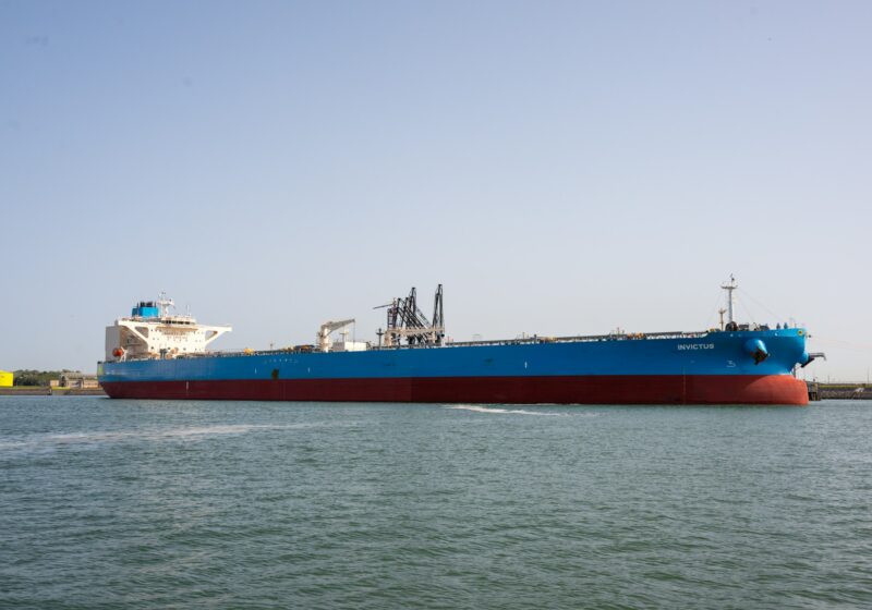 Large blue and red tanker in a harbor