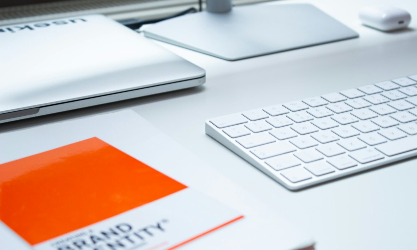 Laptop and keyboard on a clean desk, illustrating desktop AI workflows